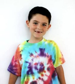 Little boy wearing a tie dye tshirt.